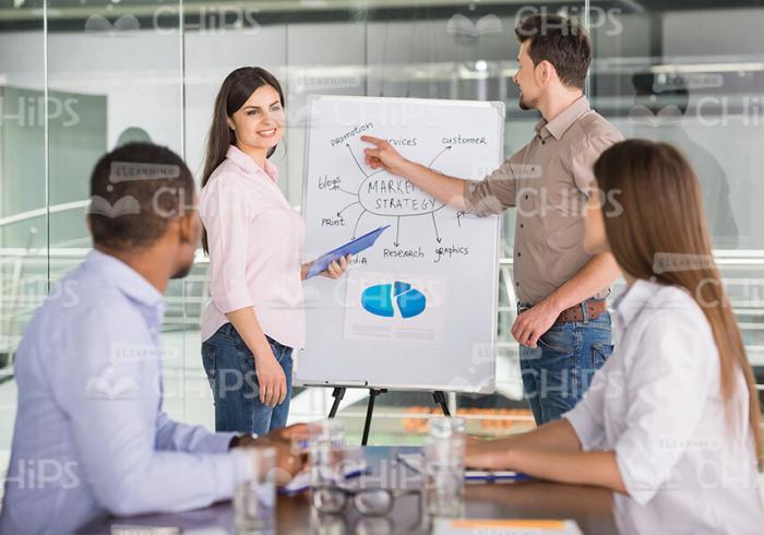Student And Lecturer Standing Next The Flipchart Stock Photo