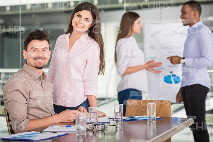 Handsome Business People Taking Part In Conference Stock Photo