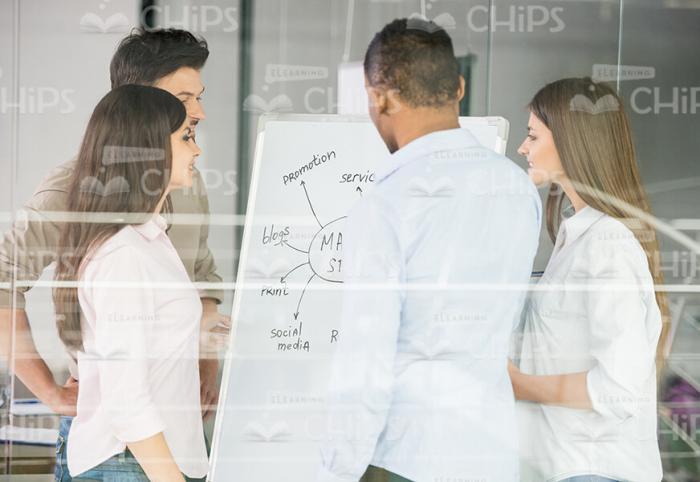 Young People Discussing Graph Stock Photo
