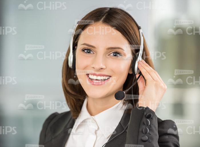 Smiling Businesswoman Wearing Headset Stock Photo