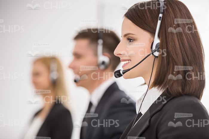 Handsome Lady With Headset Profile View Stock Photo