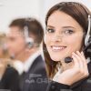 Young Customer Service Representative Looks At Camera Stock Photo