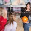 Glad Young Lady At Bowling Alley Stock Photo