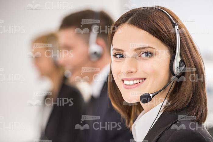 Cheerful Female Call Center Advisor Stock Photo