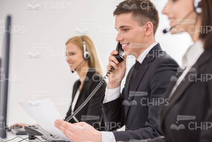 Smiling Manager Talking On Telephone Stock Photo
