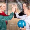 Four Ladies Giving Fives To Each Other Stock Photo