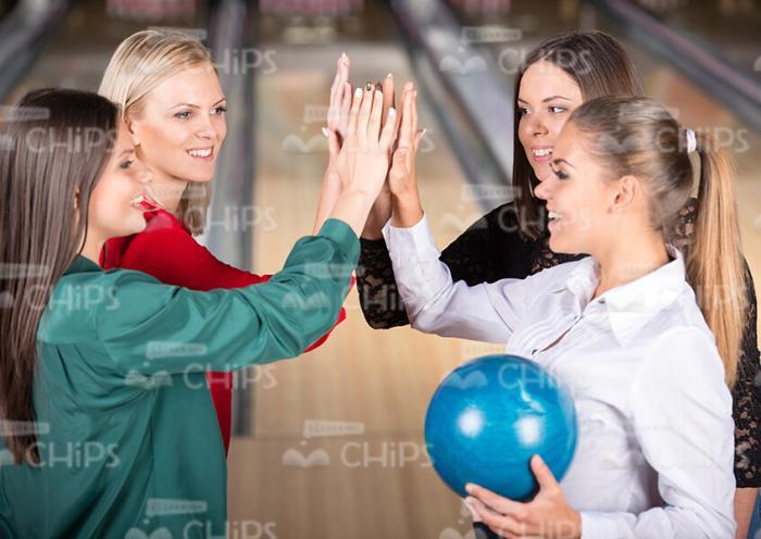 Four Ladies Giving Fives To Each Other Stock Photo