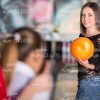 Nice Girl Holds Orange Bowling Ball Stock Photo
