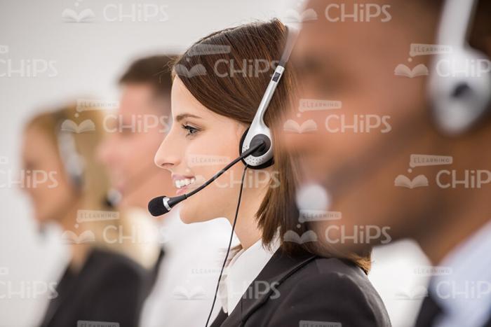 Presentable Young Lady Wears Headset Stock Photo