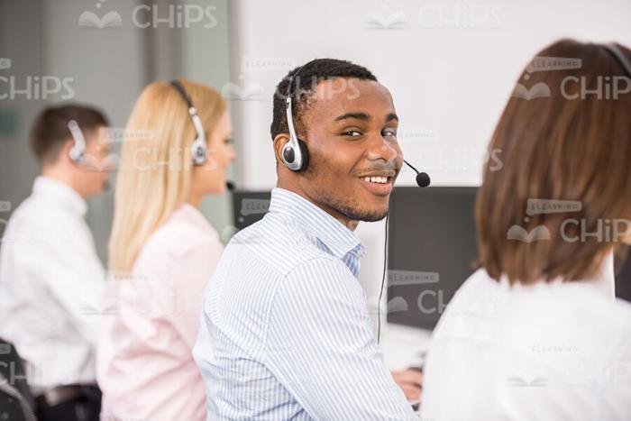Young Man In Headphones At Work Stock Photo