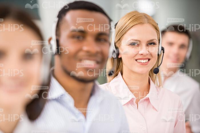 Young Lady With Her Colleagues Stock Photo