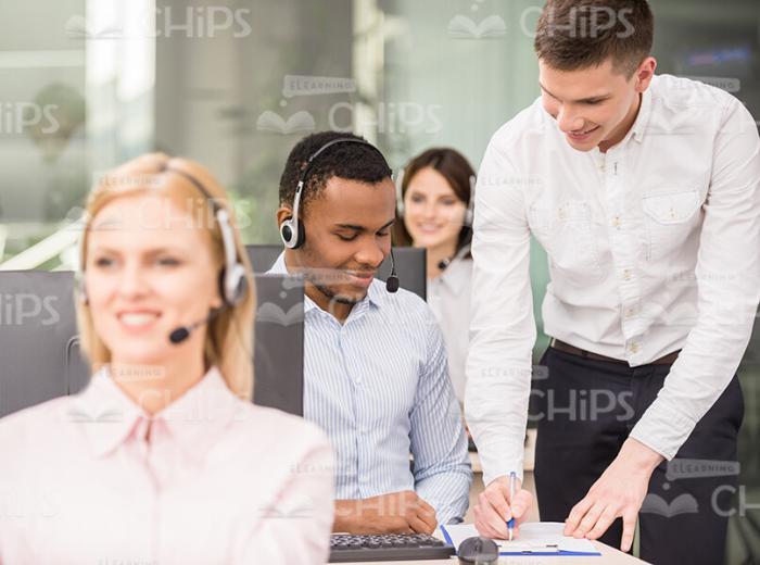 Headman Showing Something On a Paper To Worker Stock Photo