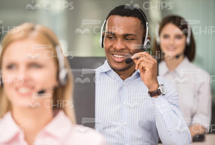 Cheerful Man Talking With Client Stock Photo