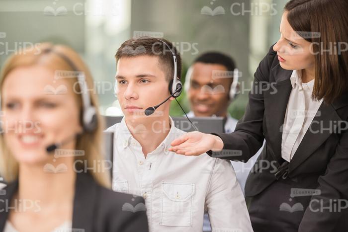 Angry Female Manager Asking Her Colleague Stock Photo