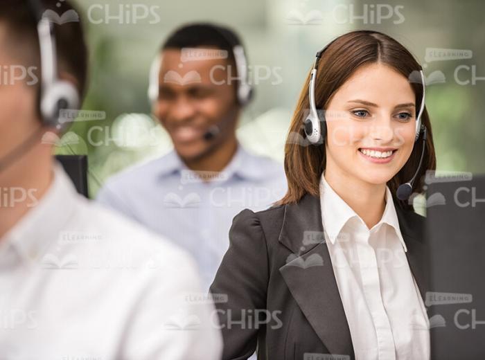 Happy Young Woman Working At Office Stock Photo