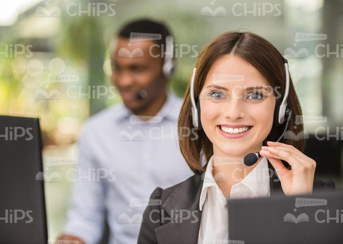 Happy Call Center Operator Looking At Camera Stock Photo