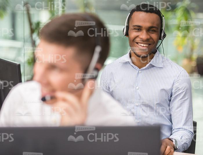 Happy Young Call Center Operators Stock Photo