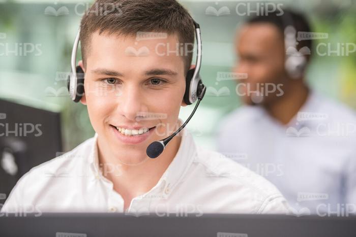 Cheerful Young Man Wearing Headphones Stock Photo