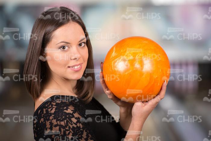 Nice Young Lady Plays Bowling Stock Photo