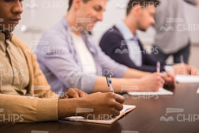 Black Young Man Making Notes Stock Photo