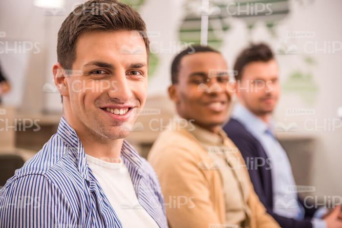 Happy Young Man At Meeting Room Stock Photo