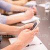 Man's Hands Holding Mobile Phone Stock Photo