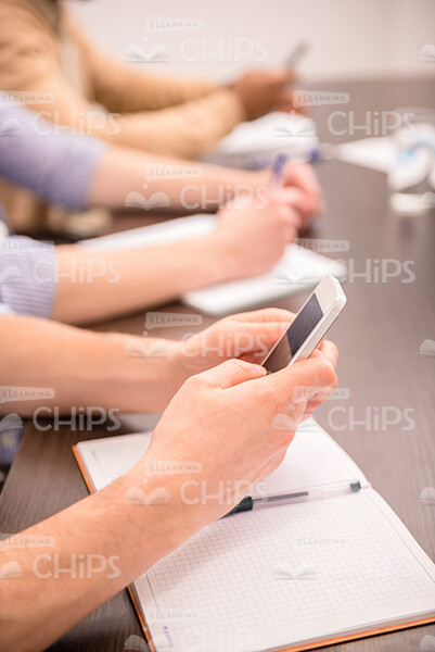 Man's Hands Holding Mobile Phone Stock Photo
