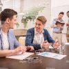 Casually Dressed Businessmen At Conference Stock Photo