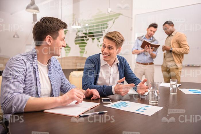 Casually Dressed Businessmen At Conference Stock Photo