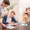 Smiling Business Men At Training Stock Photo