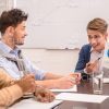 Young Man Presenting Circle Diagram Stock Photo