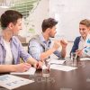 Smiling Men Discussing Their Common Businesses