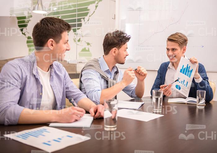 Smiling Men Discussing Their Common Businesses