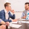 Business Trainer Explaining Material To His Students Stock Photo