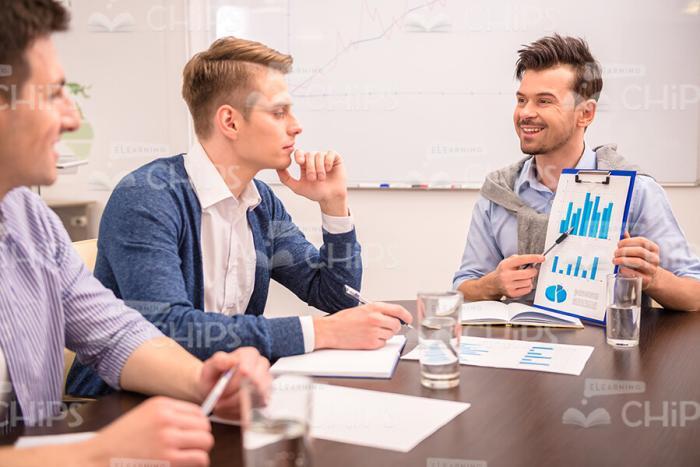 Business Trainer Explaining Material To His Students Stock Photo