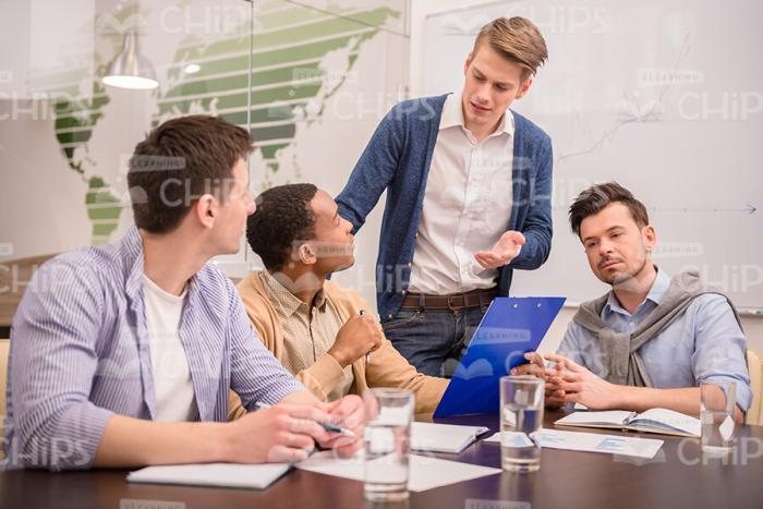 Business Trainer Comes Into Room And Asks Question Stock Photo