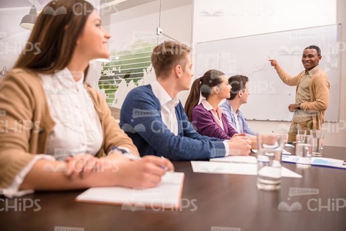 Young Tutor Talking To Listeners Stock Photo