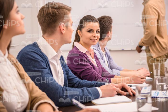 Smiling Young Woman At Conference Stock Photo