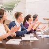 Students Applauding To Lecturer Stock Photo