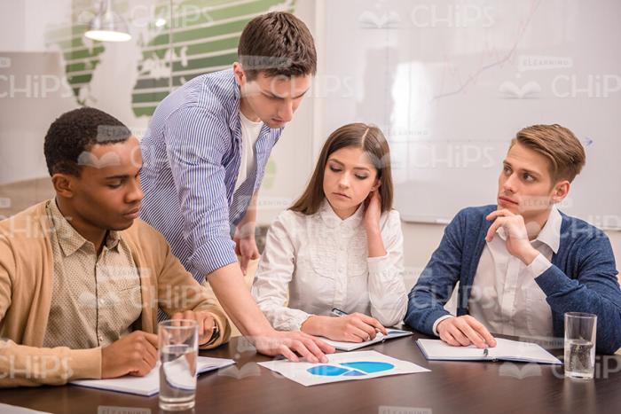 Young People Discussing The Graph Stock Photo