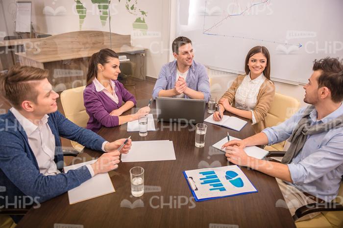 Team Of Young People Discussing Something Stock Photo