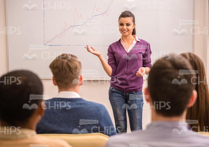 Female Speaker Holding Business Meeting Stock Photo