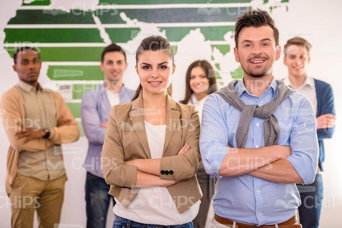 Self-Confident Business Team Standing With Crossed Arms Stock Photo