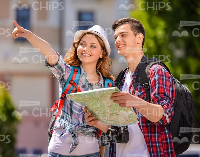 Happy Couple Of Tourists With City Map Stock Photo