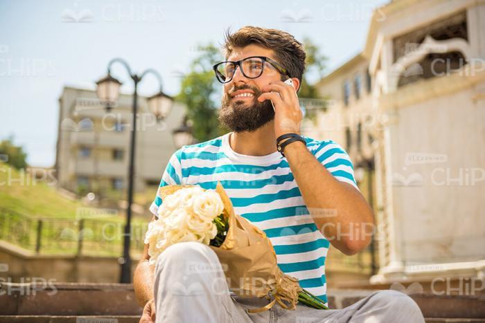 Nice Bearded Guy Talking On Mobile Phone Stock Photo