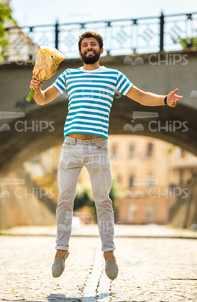 Extremely Happy Young Man With Bouquet Stock Photo