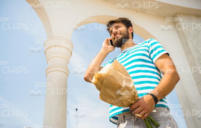 Handsome Bearded Man Using Mobile Phone Stock Photo