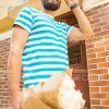 Young Guy With Bouquet Walking Stock Photo