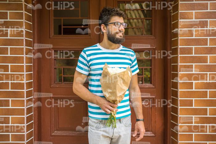 Bearded Man With Bouquet of Flowers Stock Photo