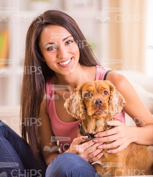 Woman With Dog At Home Stock Photo